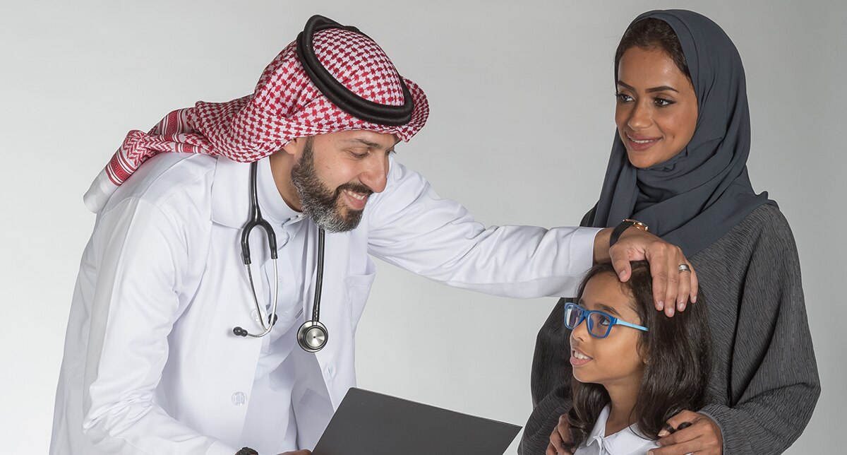 Saudi Mother and her daughter talking to a Saudi doctor