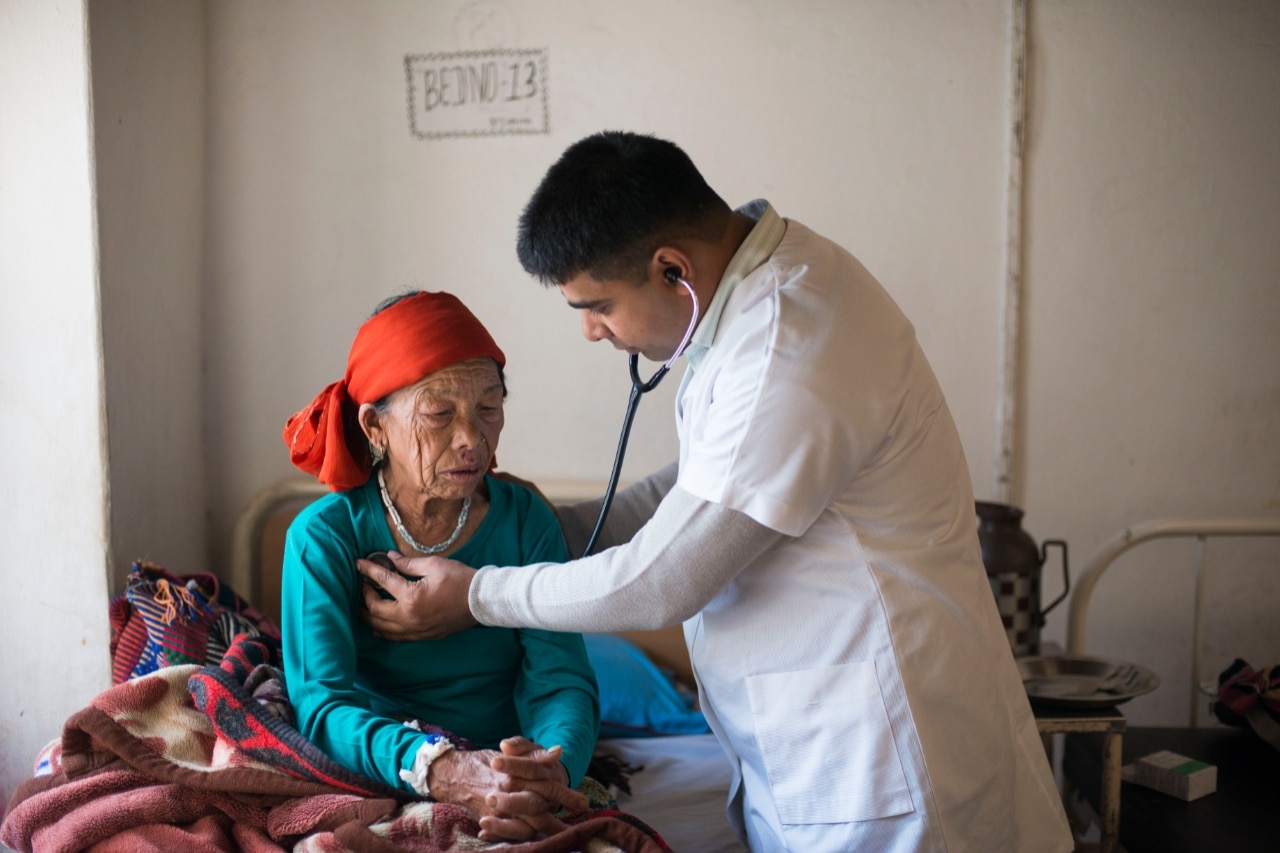 Image depicting a woman being checked by doctor in third world clinic