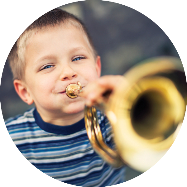 young-blonde-boy-playing-the-trumpet-482855233-circle
