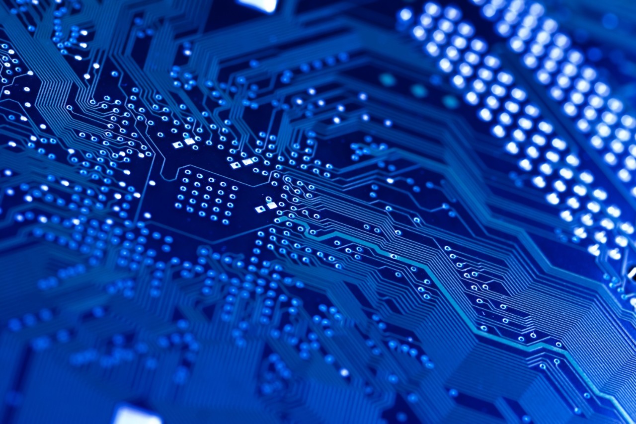 Computer circuit board in blue.  Shallow DOF on diagonal.